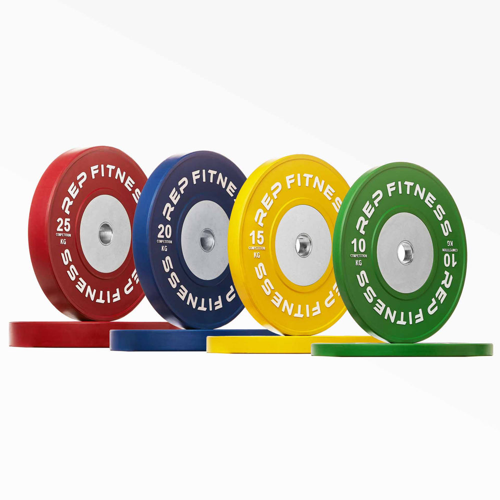 Full set of Competition Bumper Plate (KG) Pairs: red 25, blue 20, yellow 15, and green 10kg pairs. REP Competition Bumper Plates are premium colour-coded KG Olympic weightlifting plates designed for low bounce, ultra-durability, and repeated drops from overhead from Rep Fitness UK | Shop Premium Gym Equipment for Home & Commercial Use Online | Best Online Gym Equipment UK