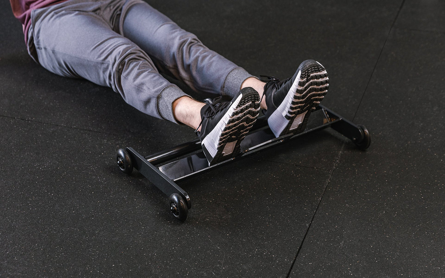 Feet resting on the foot tray of the Glute Ham Roller ideal for strengthening posterior chain muscles lightweight and portable perfect for home gyms and commercial facilities from Rep Fitness UK | Shop Premium Gym Equipment for Home & Commercial Use Online | Best Online Gym 