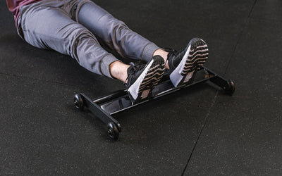 Feet resting on the foot tray of the Glute Ham Roller ideal for strengthening posterior chain muscles lightweight and portable perfect for home gyms and commercial facilities from Rep Fitness UK | Shop Premium Gym Equipment for Home & Commercial Use Online | Best Online Gym 