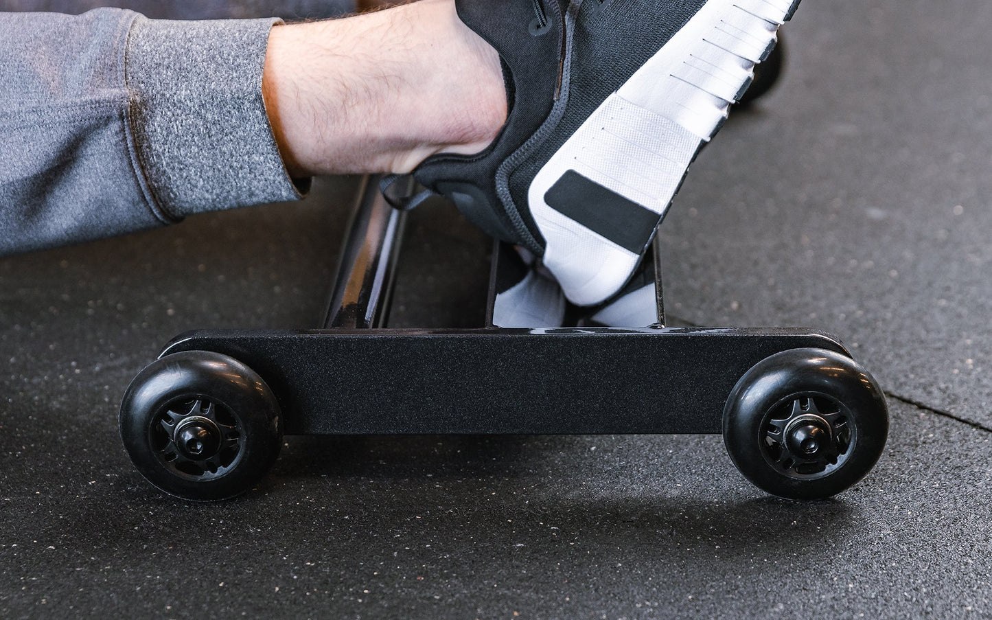 Close up of feet on the foot tray of the Glute Ham Roller ideal for strengthening posterior chain muscles lightweight and portable perfect for home gyms and commercial facilities from Rep Fitness UK | Shop Premium Gym Equipment for Home & Commercial Use Online | Best Online Gym 