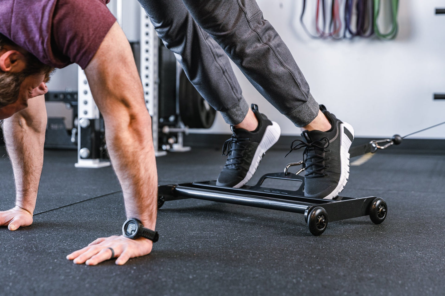 Athlete using Glute Ham Roller for ab exercises with strap attached to a functional trainer ideal for strengthening posterior chain muscles lightweight and portable perfect for home gyms and commercial facilities from Rep Fitness UK | Shop Premium Gym Equipment for Home & Commercial Use Online | Best Online Gym 