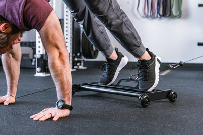 Athlete using Glute Ham Roller for ab exercises with strap attached to a functional trainer ideal for strengthening posterior chain muscles lightweight and portable perfect for home gyms and commercial facilities from Rep Fitness UK | Shop Premium Gym Equipment for Home & Commercial Use Online | Best Online Gym 