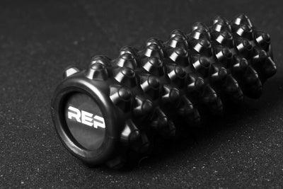 High Density Foam Roller - Showing peaked texture and REP logo on the end from Rep Fitness UK | Shop Best Premium Gym Equipment for Home & Commercial Use Online