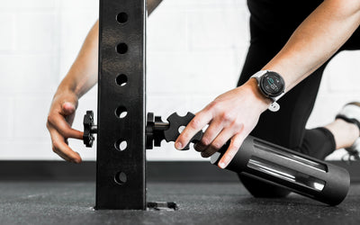 An athlete installing the base of the Rack Mounted REP® x Kleva Built® Adroit Landmine on a rack from Rep Fitness UK | Shop Premium Gym Equipment for Home & Commercial Use Online | Best Online Gym Equipment UK