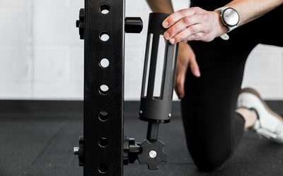 An athlete attaching the base of the Rack Mounted REP® x Kleva Built® Adroit Landmine to the magnetic top piece from Rep Fitness UK | Shop Premium Gym Equipment for Home & Commercial Use Online | Best Online Gym Equipment UK