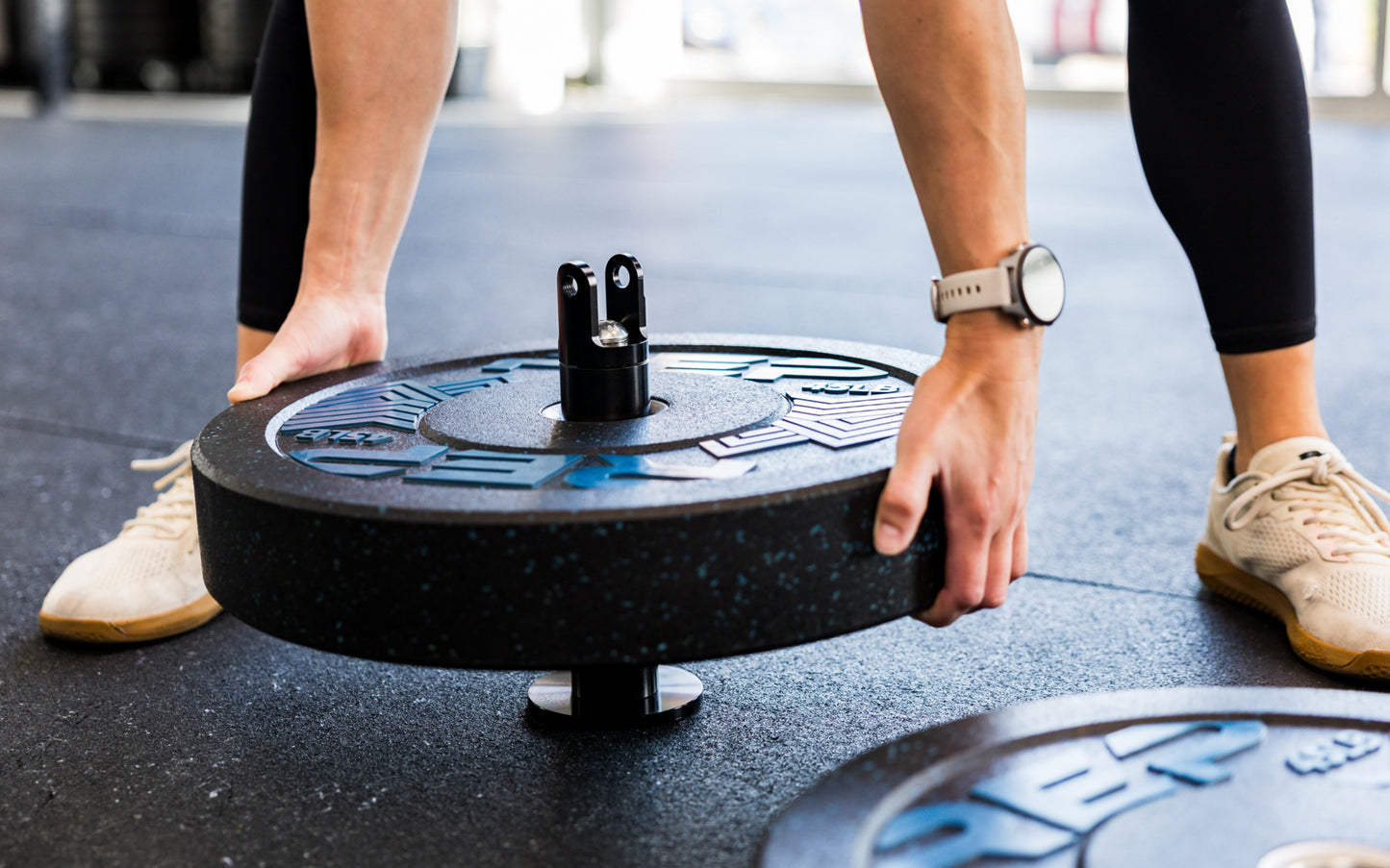 An athlete loading plates onto the Free Standing REP® x Kleva Built® Adroit Landmine from Rep Fitness UK | Shop Premium Gym Equipment for Home & Commercial Use Online | Best Online Gym Equipment UK
