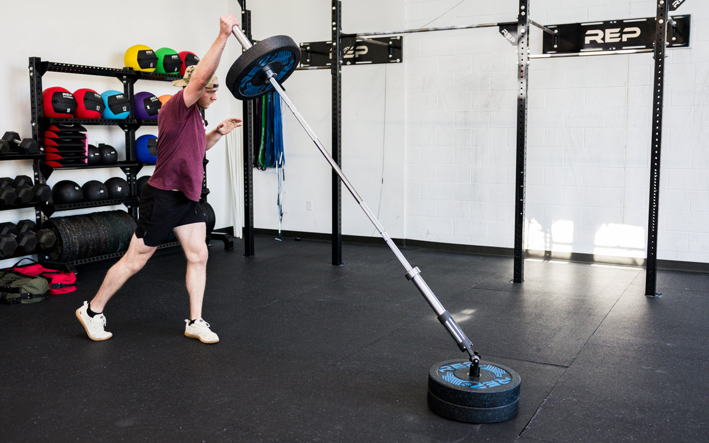 An athlete performing standing presses with the Free Standing REP® x Kleva Built® Adroit Landmine from Rep Fitness UK | Shop Premium Gym Equipment for Home & Commercial Use Online | Best Online Gym Equipment UK