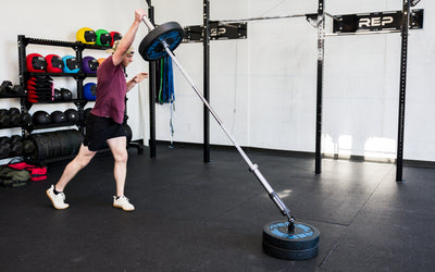 An athlete performing standing presses with the Free Standing REP® x Kleva Built® Adroit Landmine from Rep Fitness UK | Shop Premium Gym Equipment for Home & Commercial Use Online | Best Online Gym Equipment UK