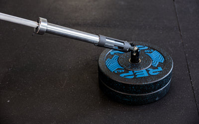 A barbell being slid into the polycarbonate sleeve of the Free Standing REP® x Kleva Built® Adroit Landmine from Rep Fitness UK | Shop Premium Gym Equipment for Home & Commercial Use Online | Best Online Gym Equipment UK