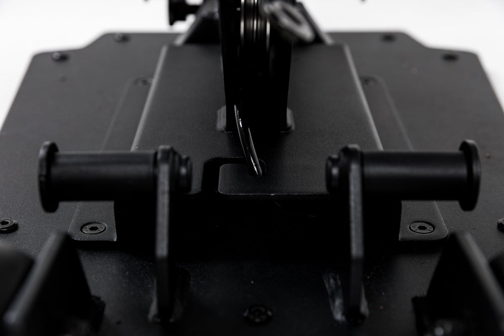 Close-up shot of the band pegs and cable housing on the Leg Extension & Leg Curl Bench Attachment