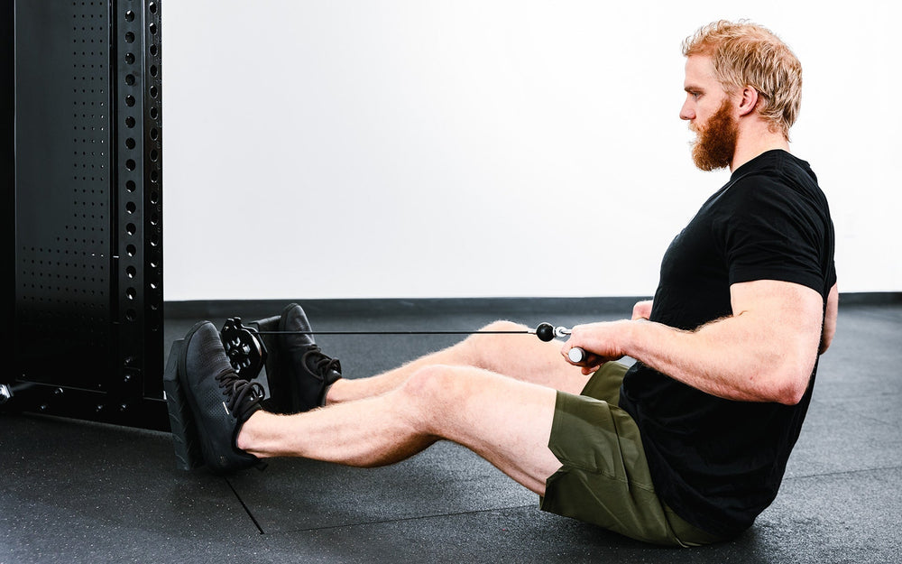 Man using Adonis™ Cable Tower plate loaded, Selectorized no Pegasus with base, premium space-saving cable machine for home or commercial gyms, 1:1 and 2:1 pulley ratios, 34 cable positions, and compatibility with REP’s 5000 Series racks, Pegasus™ attachment, and Modular Storage System for unmatched versatility and performance from Rep Fitness UK | Shop Premium Gym Equipment for Home & Commercial Use, Best Online Gym Equipment