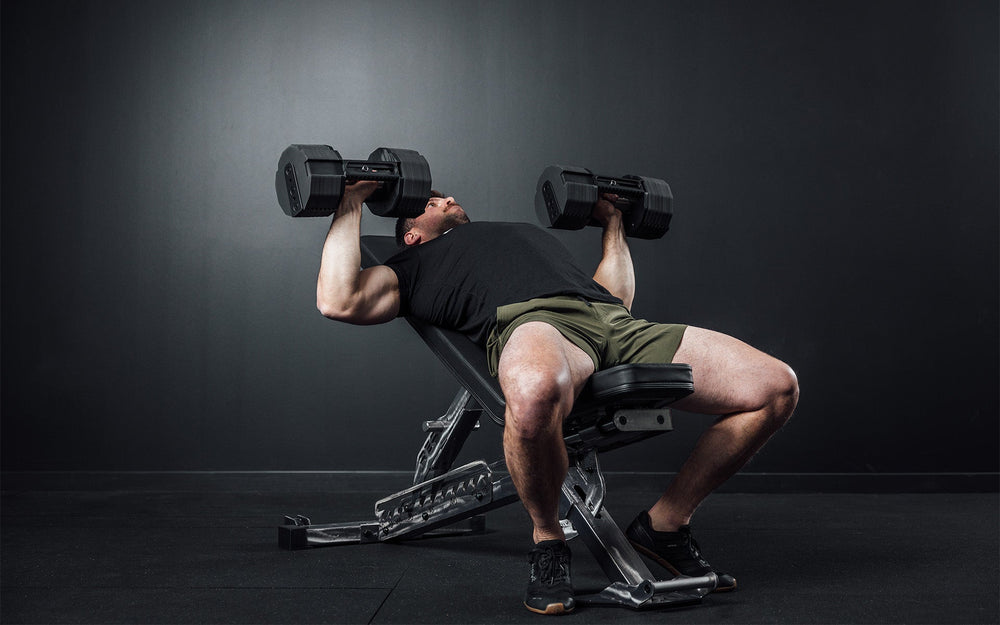 Man using Pepin dumbbells on bench from Rep Fitness UK | Shop Premium Gym Equipment for Home & Commercial Use Online | Best only gym equipment UK