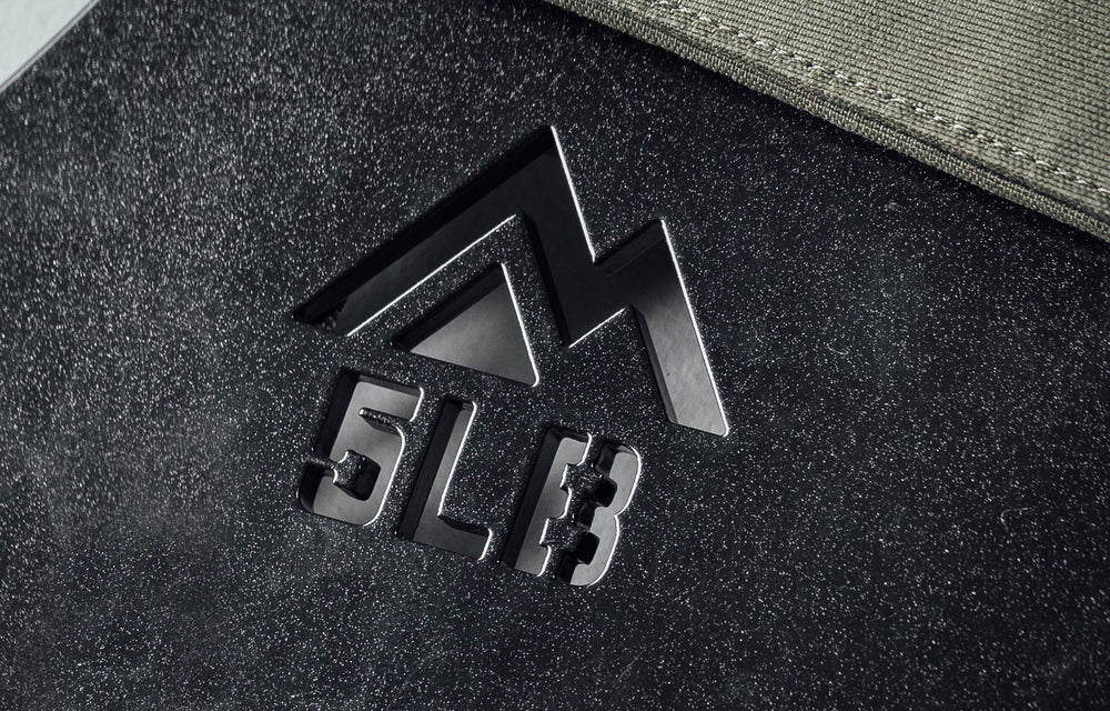 Mountain logo cutout and weight cutout on the Strata Weight Vest Plates, durable steel construction, ergonomic rib contour, tapered edges, top/bottom handles, compatible with REP Strata™ vest for functional fitness and HIIT from Rep Fitness UK | Shop Premium Gym Equipment for Home & Commercial Use, Best Online Gym Equipment UK