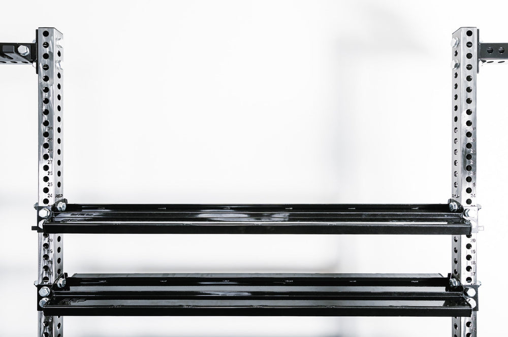 Mounted Dumbbell and Kettlebell Storage Shelves – heavy-duty 11-gauge reversible gym storage shelf for dumbbells, kettlebells, balls, and accessories; 72” metallic black powder-coated rack with laser-cut REP logo, secure lips, and bolt-on design compatible with 4000 and 5000 Series power racks for organized home or commercial gym storage from Rep Fitness UK | Shop Premium Gym Equipment for Home & Commercial Use, Best Online Gym Equipment UK