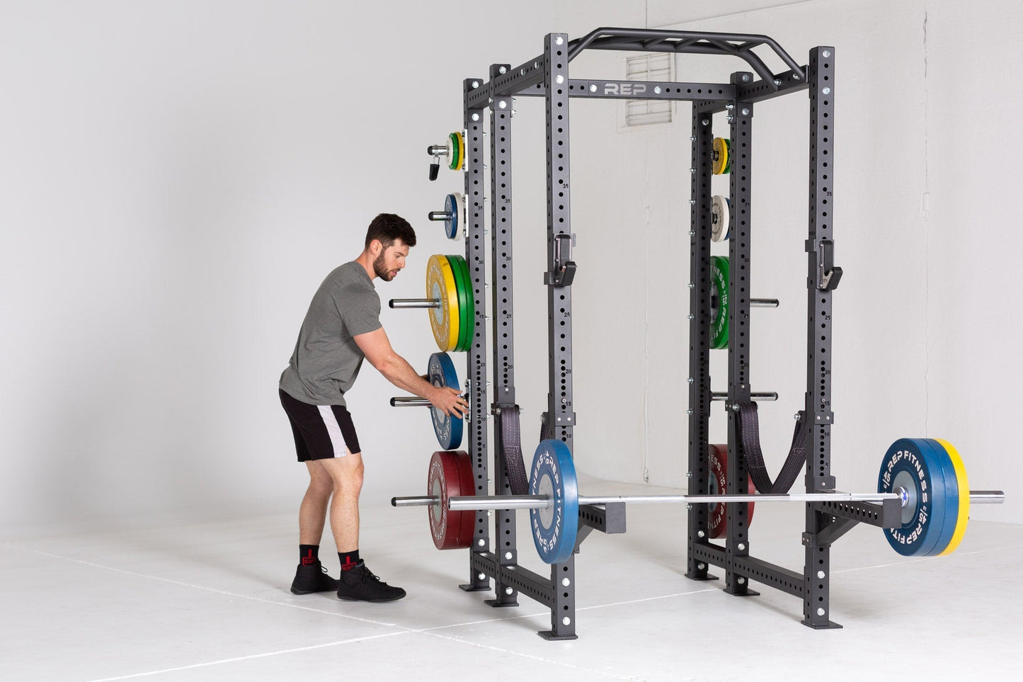 Multi-Grip Pull-Up Bar on Power Rack, durable 14-gauge steel bar; features 1.25” front and angled/neutral grips, 2” rear bar, multiple grip options (6”–28.4”), attach bands for added versatility, reversible for low ceilings, space-saving home gym pull-up station from Rep Fitness UK | Shop Premium Gym Equipment for Home & Commercial Use, Best Online Gym Equipment