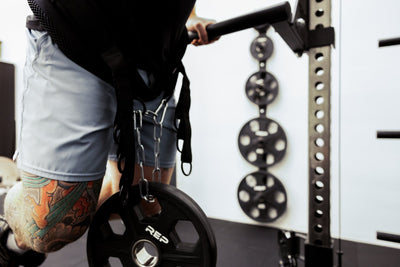 Person using belt squat belt for weighted dips from Rep Fitness UK | Shop Best Premium Gym Equipment for Home & Commercial Use Online