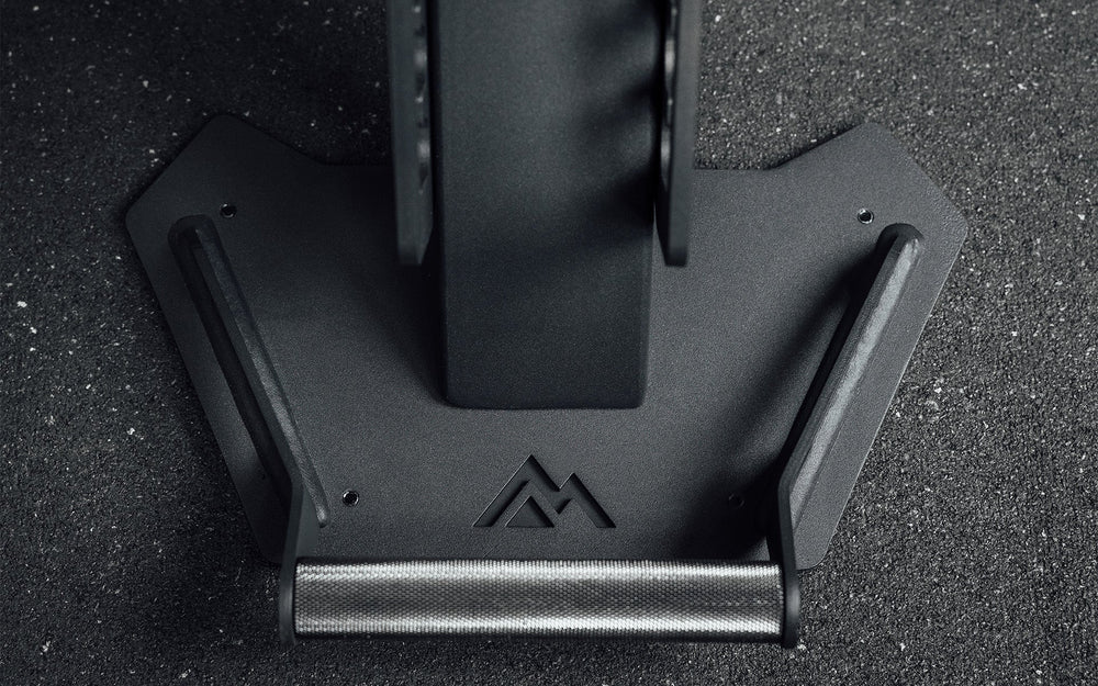 Nighthawk matte black bench foot rest with brand insignia closeup from Rep Fitness UK | Shop Premium Gym Equipment for Home & Commercial Use Online