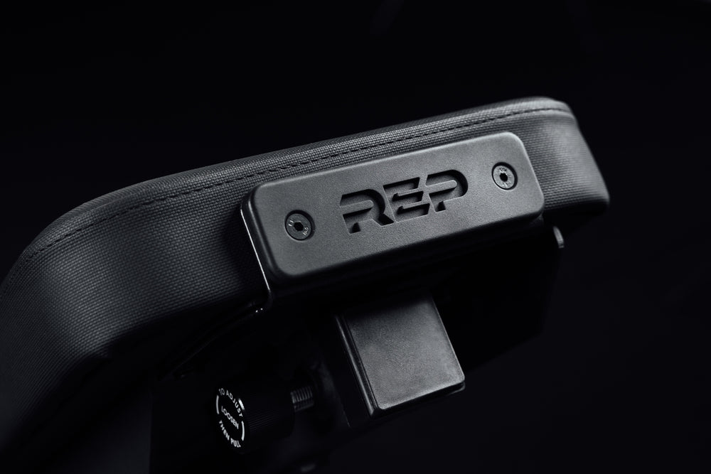 Nighthawk matte black bench pad closeup sideview with metal brand icon from Rep Fitness UK | Shop Premium Gym Equipment for Home & Commercial Use Online