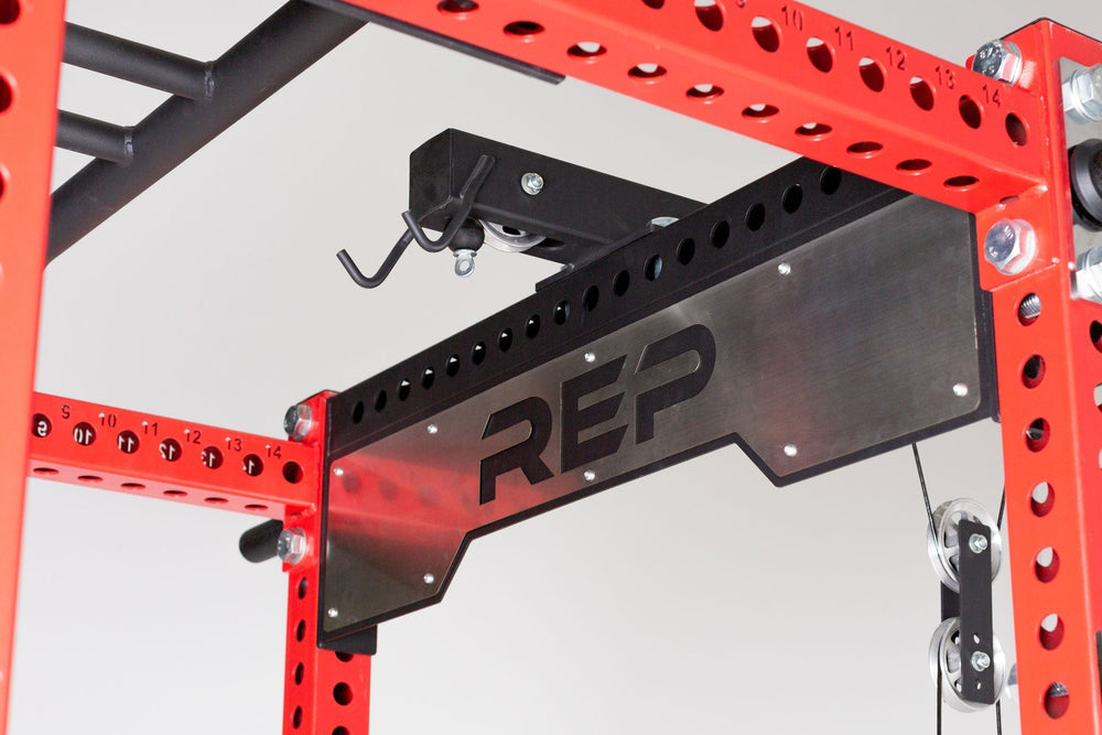 Omni Rack Close Up of Logo Plate Crossmember 5000 Series heavy-duty gauge steel rack stabilizer with laser-cut holes, enhances rack stability and adds premium gym aesthetics from Rep Fitness UK | Shop Premium Gym Equipment for Home & Commercial Use, Best Online Gym Equipment UK