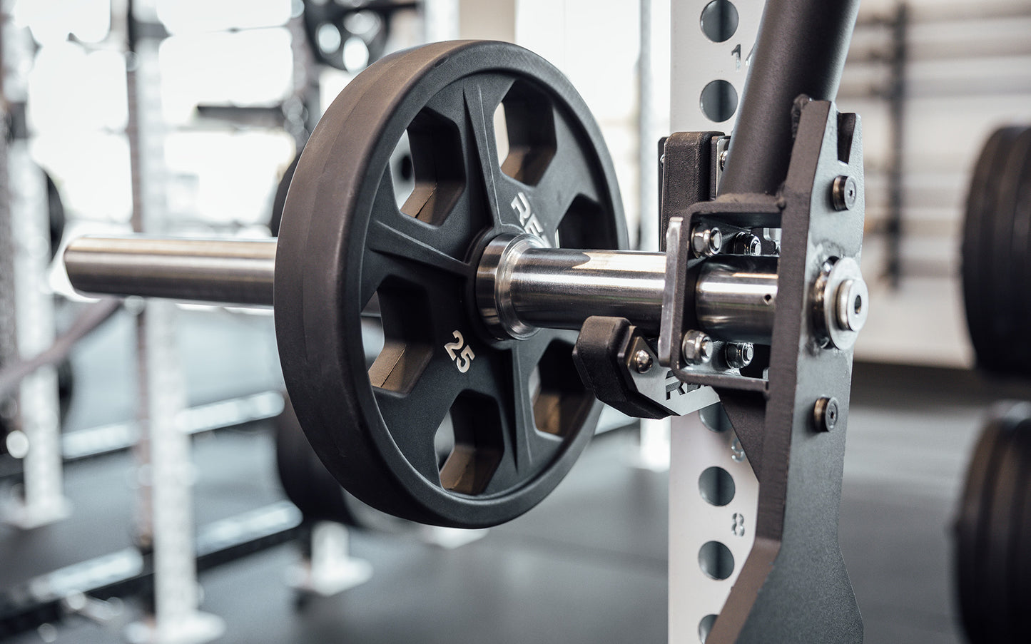 Female athlete performing a deadlift with the REP Open Trap Bar.