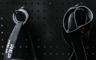 Close up of accessories hanging on pegboard storage hooks from Rep Fitness UK | Shop Best Premium Gym Equipment for Home & Commercial Use Online