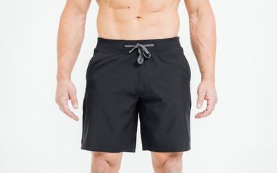 Front view of model wearing the black REP Pinnacle Shorts.