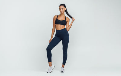 Women's Leggings- Front view of model wearing the REP Hera Tights in navy on a gray background