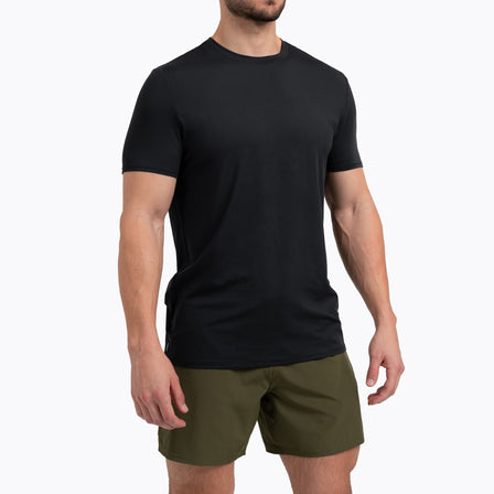 Men's Tees- Athlete wearing a black REP Men's Delta Tee on a gray background.