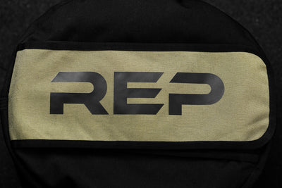 close up of stone sandbag with rep logo on green background