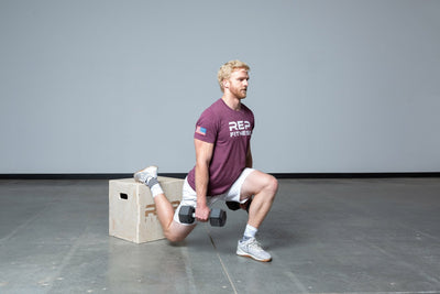 Lifter performing weighted split squats on an In-Between REP 3-in-1 Wood Plyo Box.