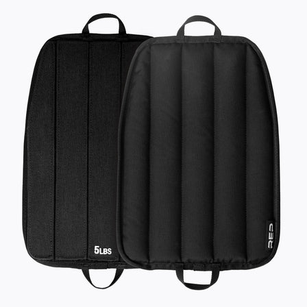 Black soft weight vest plates with '5 lbs' marking on a white background