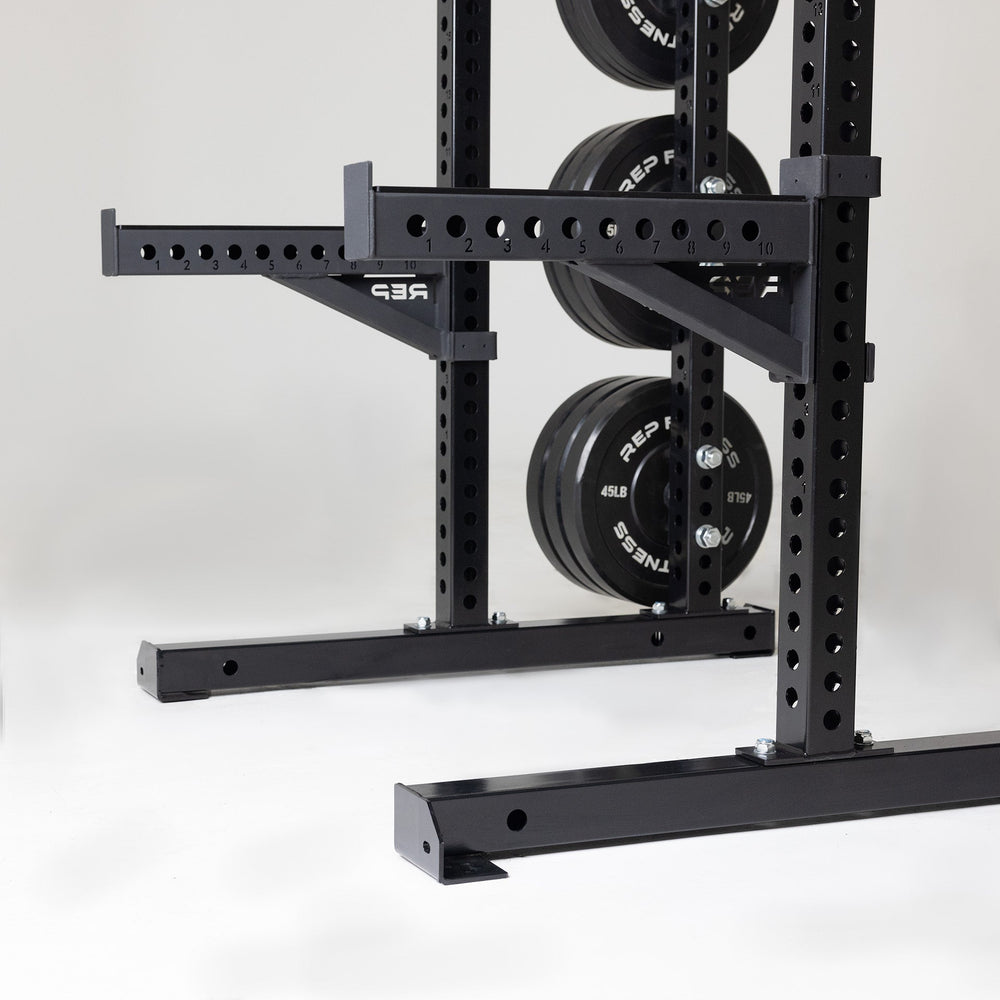 Spotter Arms on power rack, heavy-duty 24” steel safety arms for power racks; 1,000 lb capacity with polyurethane lining, steel lip for bar security, 1” attachment holes, laser-engraved numbers, and durable matte black powder coat finish from Rep Fitness UK | Shop Premium Gym Equipment for Home & Commercial Use, Best Online Gym Equipment UK