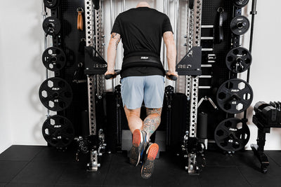 Person using belt squat belt for weighted dips from Rep Fitness UK | Shop Best Premium Gym Equipment for Home & Commercial Use Online