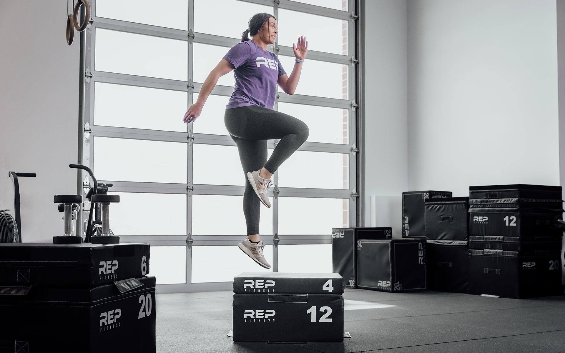Athlete jumping onto a REP stackable soft foam plyo box in a home gym from Rep Fitness UK | Shop Best Premium Gym Equipment for Home & Commercial Use Online