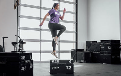 Athlete jumping onto a REP stackable soft foam plyo box in a home gym from Rep Fitness UK | Shop Best Premium Gym Equipment for Home & Commercial Use Online