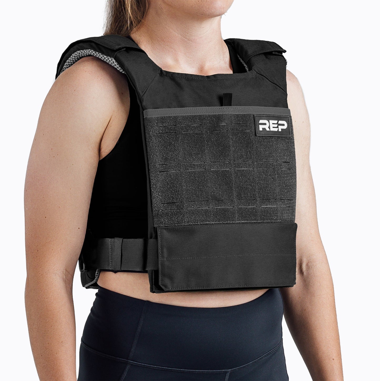 Studio Shot: REP Strata Weight Vest in Black, adjustable fit, padded ergonomic design, durable 750D Cordura®, secure plate compartments, and versatile use for strength, HIIT, and functional fitness from Rep Fitness UK | Shop Premium Gym Equipment for Home & Commercial Use, Best Online Gym Equipment UK