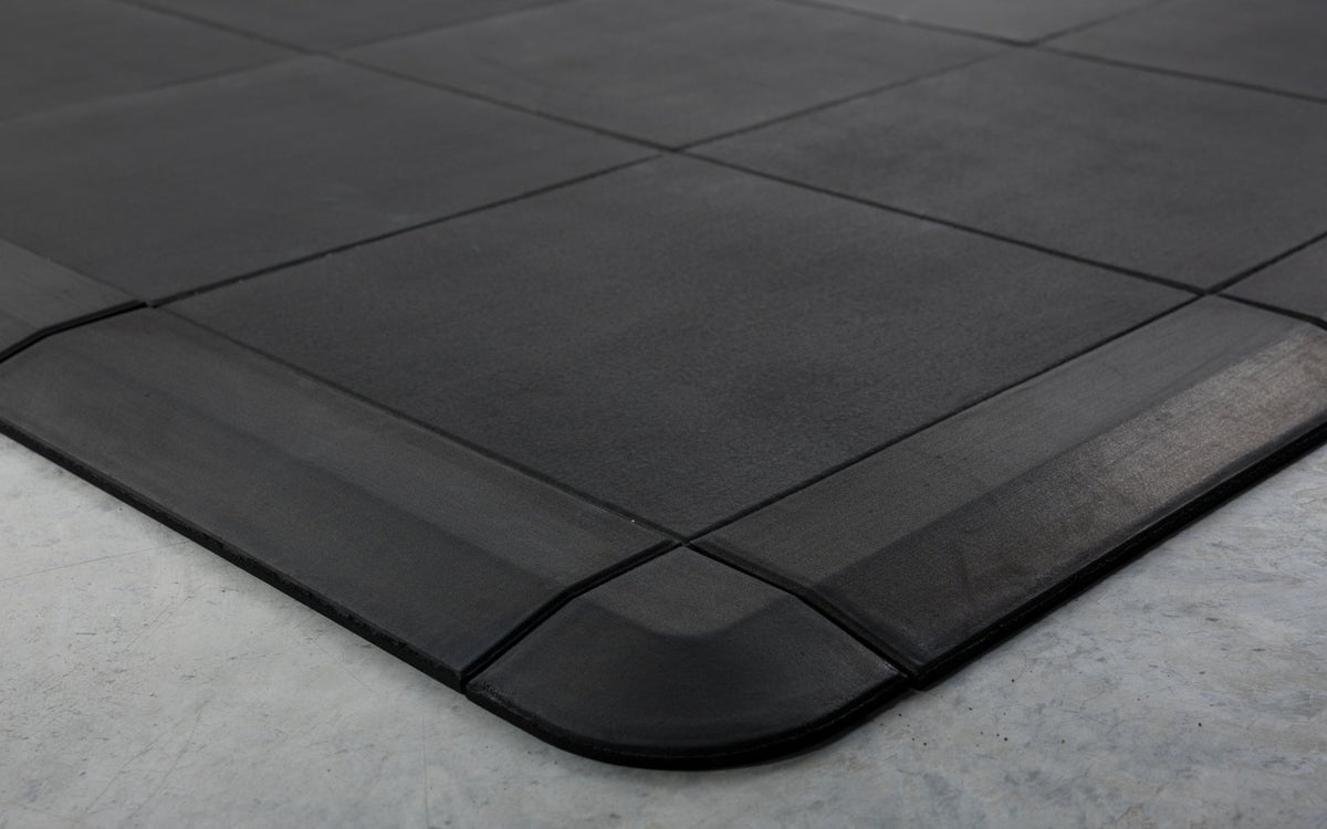 Close-up of the smooth transition that the corner and border pieces provide for the Interlocking Floor Tiles