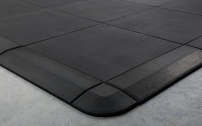 Close-up of the smooth transition that the corner and border pieces provide for the Interlocking Floor Tiles
