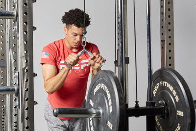 Tricep Pressdown Bar In Use add more options to your functional trainer or cable machine with this attachment from Rep Fitness UK | Shop Best Premium Gym Equipment for Home & Commercial Use Online