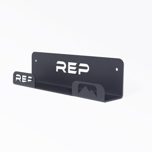 Wall-mounted flat bench hanger designed for vertical bench storage, with laser-cut REP logo from Rep Fitness UK | Shop Best Premium Gym Equipment for Home & Commercial Use Online