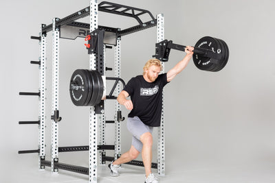 Weight Horns 5000 Series on PR-5000 Power Rack being used by man, Weight Horns 5000 Series on PR-5000 Power Rack Weight Storage, Weight Horns 5000 Series 30 cm Pair, heavy-duty steel weight horns for 5000 Series; bolt-on design, holds up to 315 lbs of plates, rubber gasket stops protect weights, and compact storage solution for organized home or commercial gyms from Rep Fitness UK | Shop Premium Gym Equipment for Home & Commercial Use, Best Online Gym Equipment UK