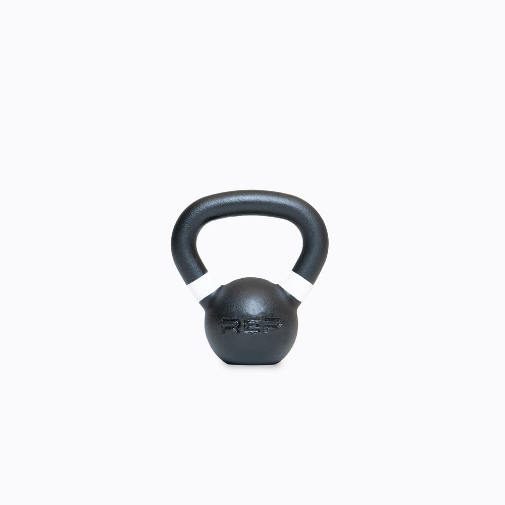 White marked kettlebell – premium cast-iron kettlebell from with color-coded handle, textured black coating for superior grip, and flat bases for stability; ideal for strength, conditioning, and full-body training; available individually or in sets from Rep Fitness UK | Shop Premium Gym Equipment for Home & Commercial Use, Best Online Gym Equipment UK