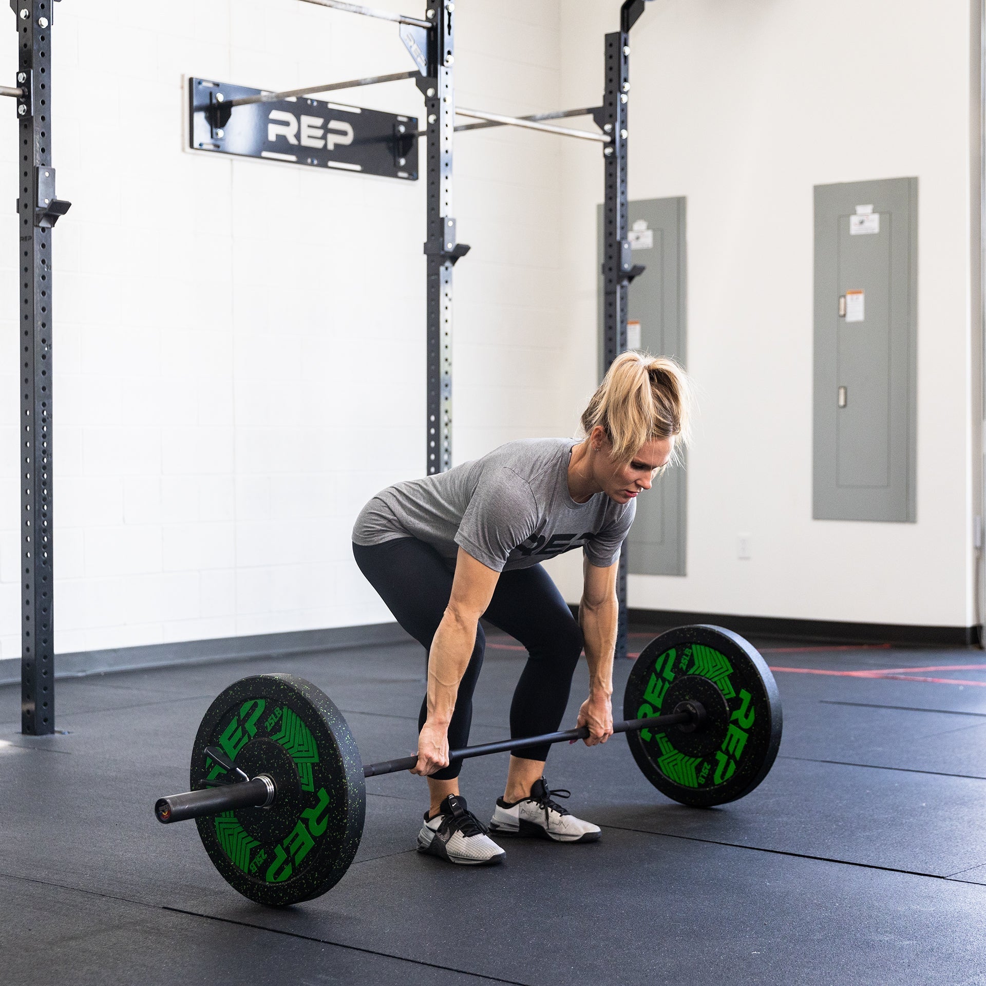 Woman using 15 kg Colorado Bar weightlifting bar for cross fit, ideal for strength training and gym workouts from Rep Fitness UK | Shop Premium Gym Equipment for Home & Commercial Use Online| Best Online Gym Equipment UK