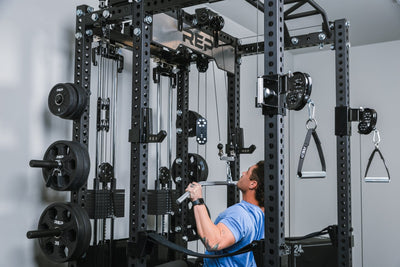 Incline press inside a rack that has a Ares™2.0 builder being put through it paces in a home gym.