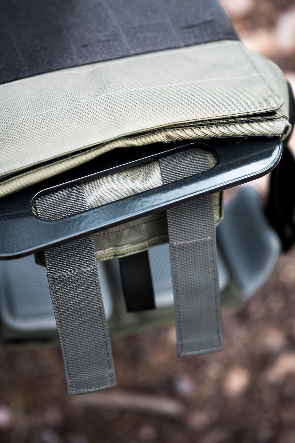 close-up of Strata Weight Vest Plate top handle almost completely inserted into the Strata weight vest, durable steel construction, ergonomic rib contour, tapered edges, top/bottom handles, compatible with REP Strata™ vest for functional fitness and HIIT from Rep Fitness UK | Shop Premium Gym Equipment for Home & Commercial Use, Best Online Gym Equipment UK