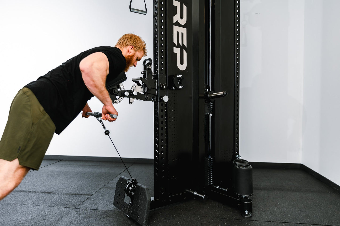 man using Pegasus attachment on Adonis™ Cable Tower plate loaded, Selectorized with base support, premium space-saving cable machine for home or commercial gyms, 1:1 and 2:1 pulley ratios, 34 cable positions, and compatibility with REP’s 5000 Series racks, Pegasus™ attachment, and Modular Storage System for unmatched versatility and performance from Rep Fitness UK | Shop Premium Gym Equipment for Home & Commercial Use, Best Online Gym Equipment