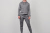 An athlete posing while wearing the grey Women's Vellus Joggers