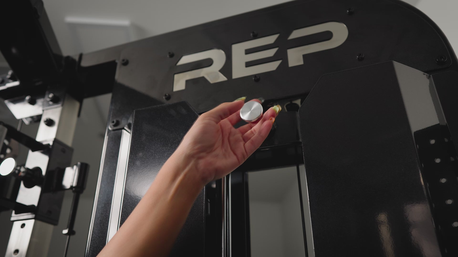 Video of someone sliding down the integrated add-on weight for the Arcadia™ stand-alone functional trainer, premium full-sized cable machine from Rep Fitness UK | Shop Premium Gym Equipment for Home & Commercial Use Online.