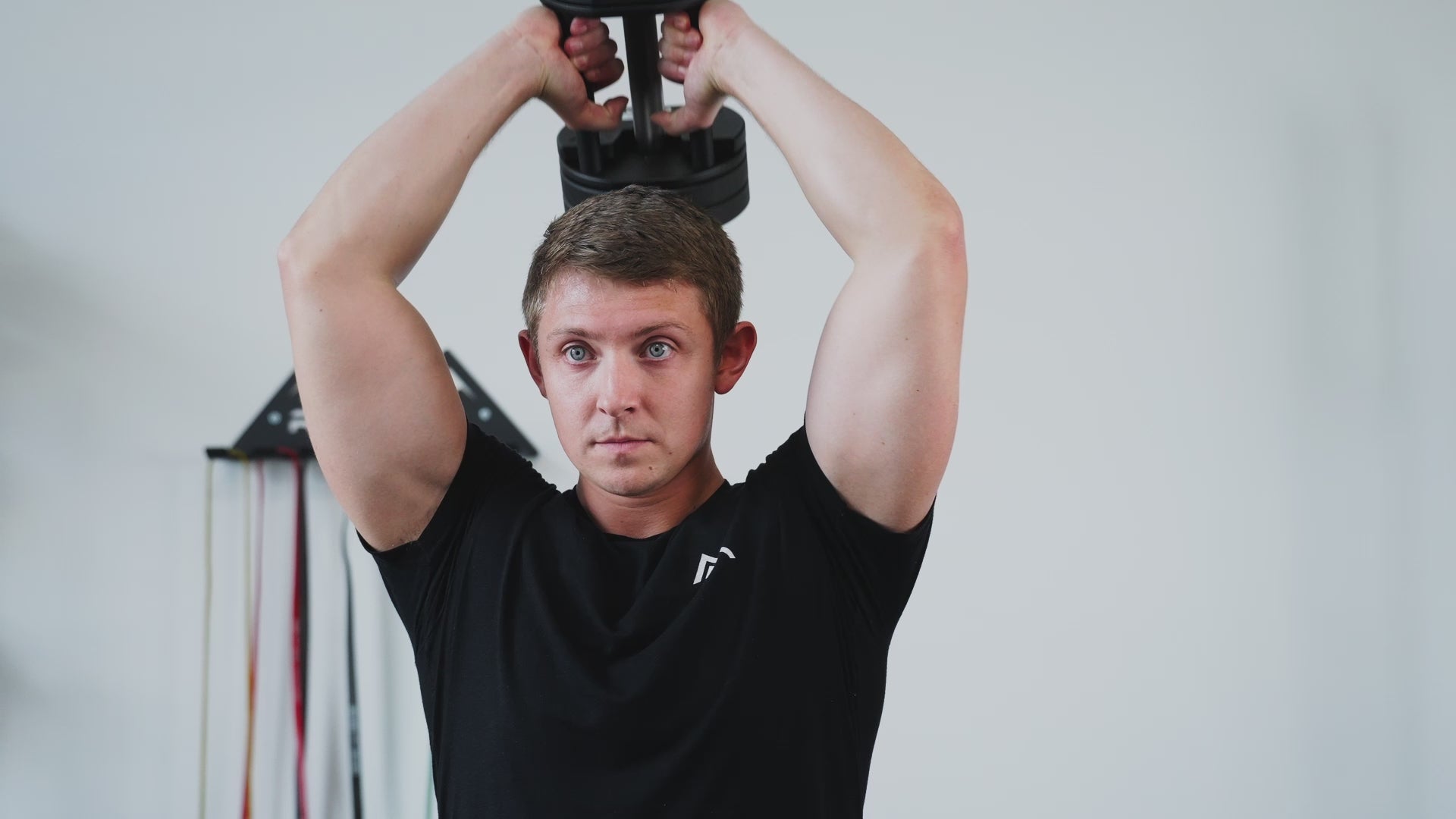 Man exercising using Premium QuickDraw dumbbells with adjustable weight, fast switch adjustable  weight range technology and secure Lock-N-Load switches for high-performance strength training from Rep Fitness UK | Shop Premium Gym Equipment for Home & Commercial Use, Best Online Gym Equipment