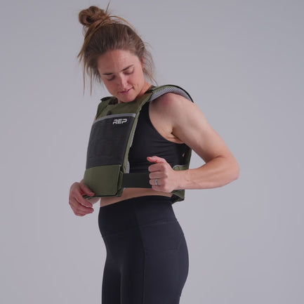 video showing the multiple adjustment points on the Strata Weight Vest, Strata Weight Vest in Olive, adjustable fit, padded ergonomic design, durable 750D Cordura®, secure plate compartments, and versatile use for strength, HIIT, and functional fitness from Rep Fitness UK | Shop Premium Gym Equipment for Home & Commercial Use, Best Online Gym Equipment UK